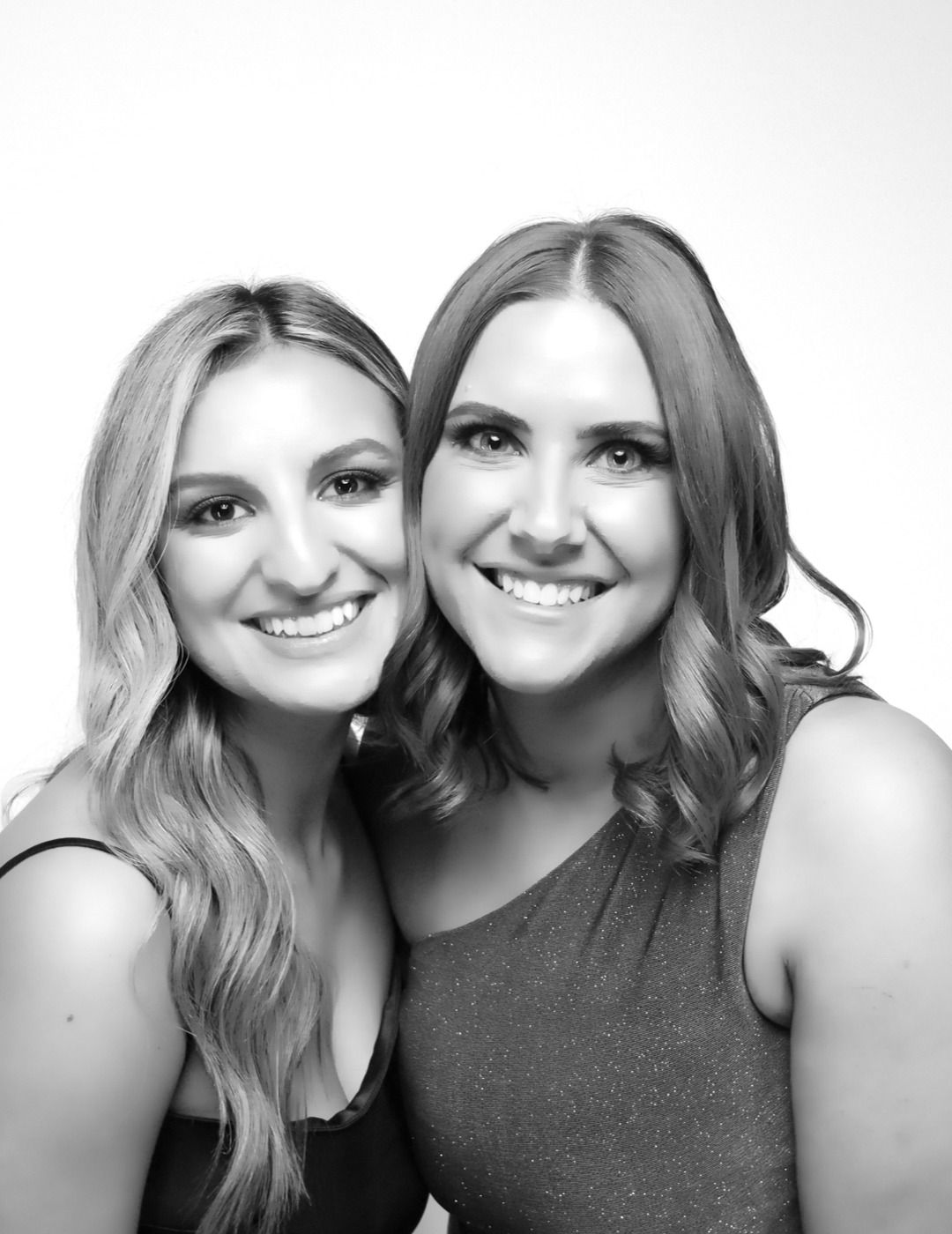 Black-and-white Glam Booth portrait: two friends cheek to cheek